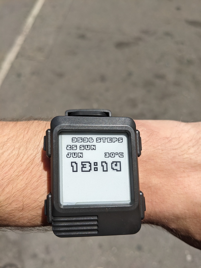 My Watchy in 2023 with its default case and band, running a modified version of the stock firmware