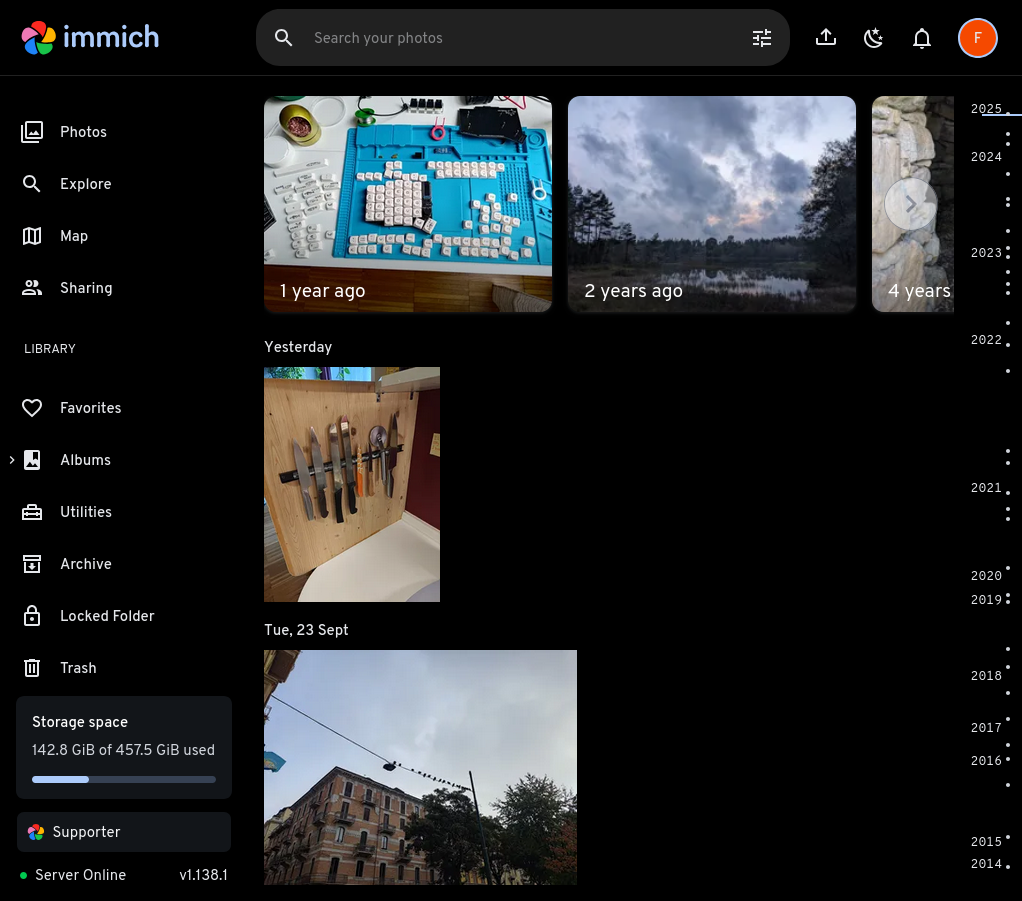 A screenshot of my instance of Immich, featuring photos of my keycaps, my newly installed kitchen knife rack, and some pigeons sleeping on a power line